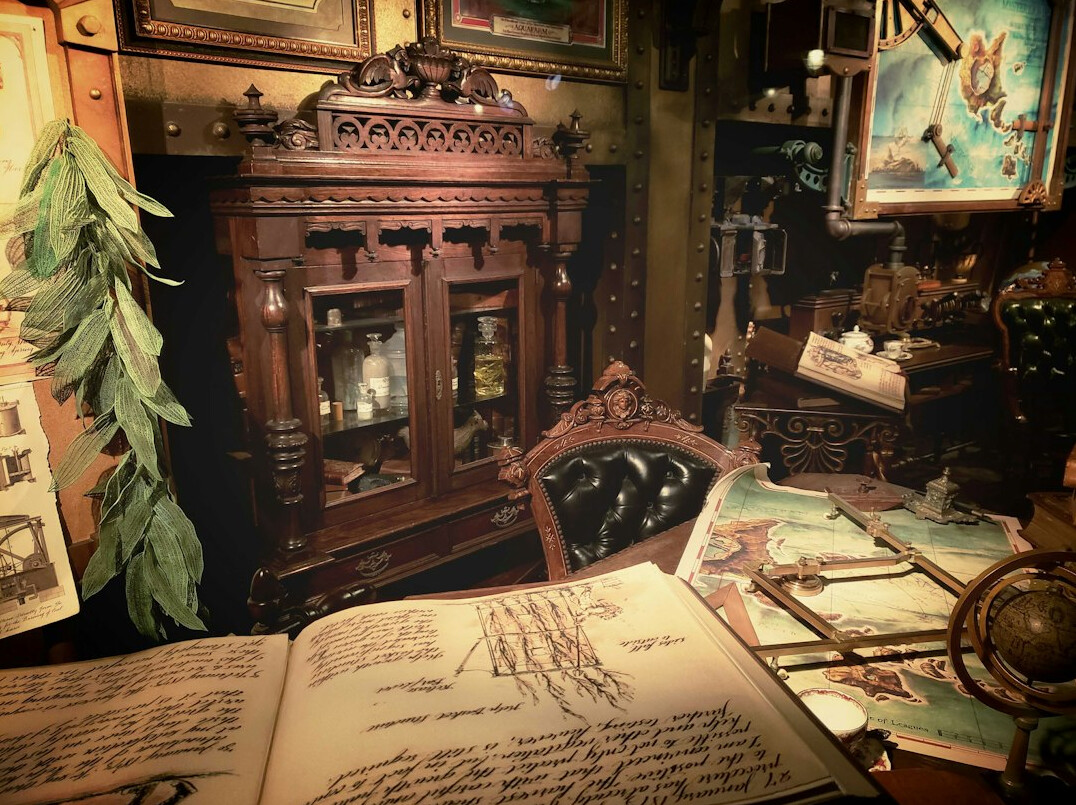 Detective desk with photographs, old documents, magnifying glass and map